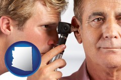 arizona an audiologist examining the ear of a patient