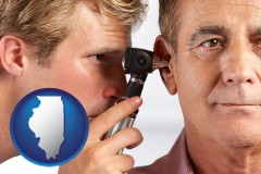 illinois an audiologist examining the ear of a patient