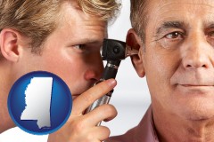 mississippi an audiologist examining the ear of a patient